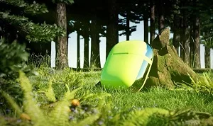 Pocbuds wireless earbuds in a green forest
